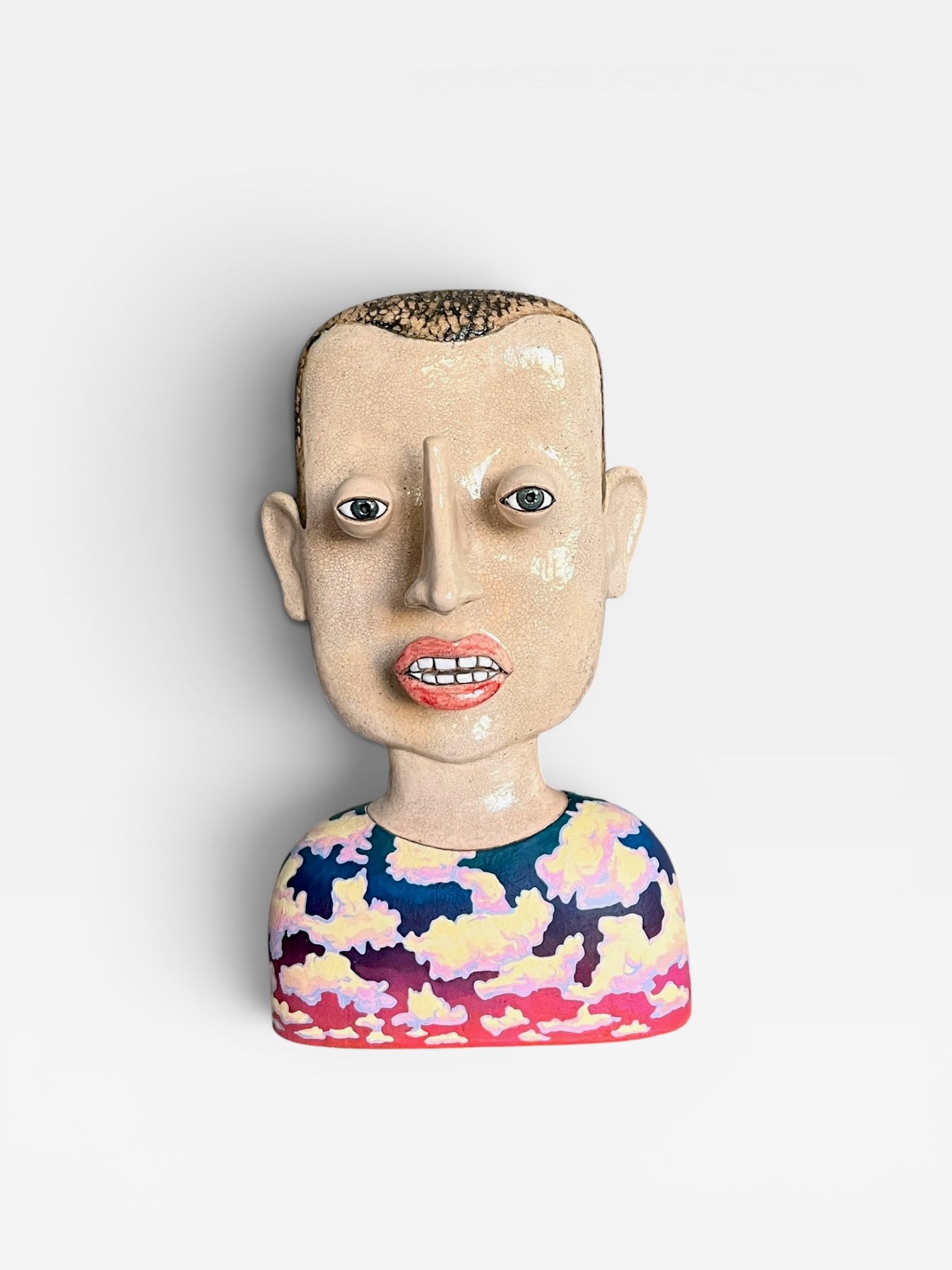 Front view of the large 42 cm surrealist ceramic bust Cloud Man featuring a Kanyū crackle glaze face and a hand-painted sunset cloud pattern on the torso.